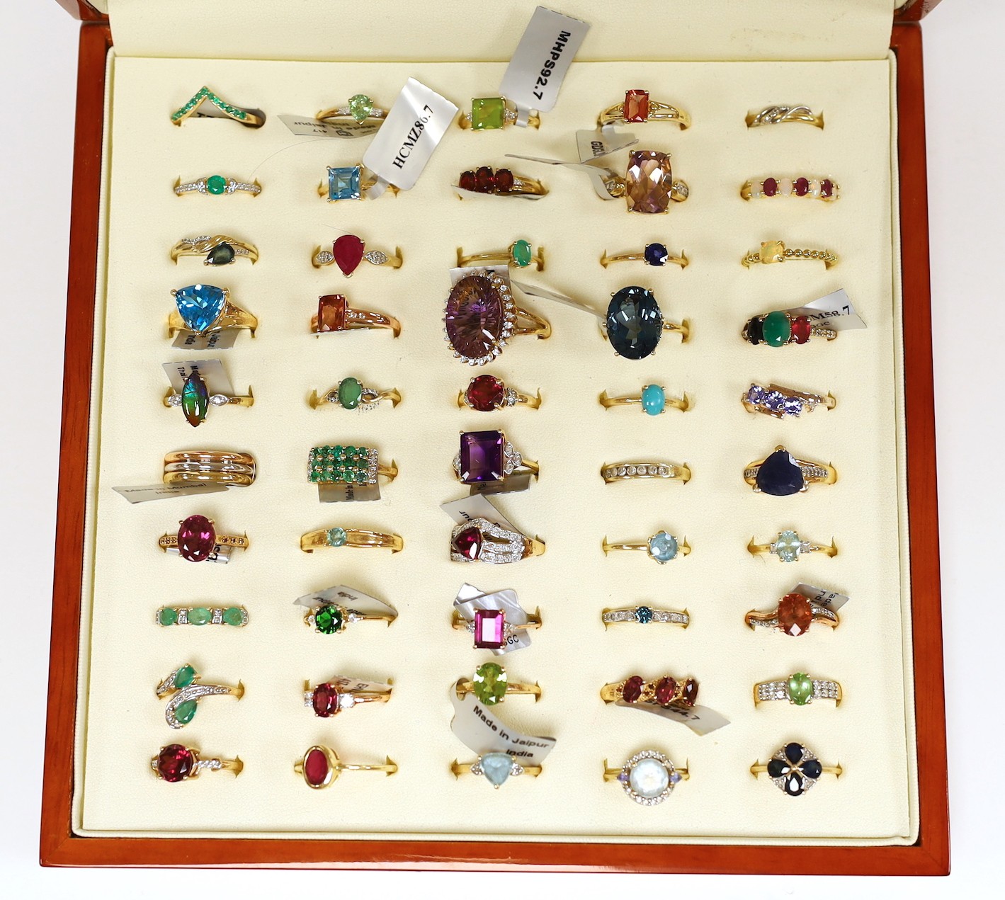 Forty three assorted modern 9ct gold and gen set dress rings including amethyst, emerald and garnet, one 18ct gold and gem set ring and six assorted 925 rings, in ring box.